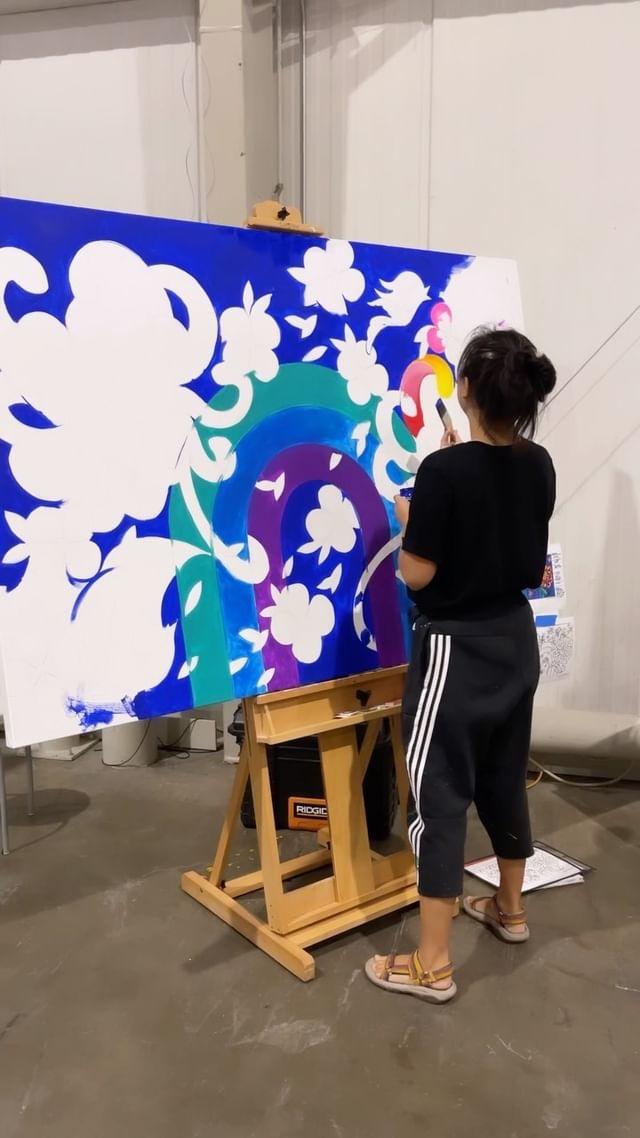Caroline Truong begins her painting